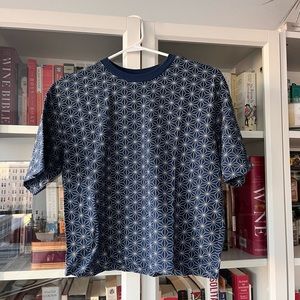 Navy and white subtle geo pattern boxy tee. Slight crop, but still full length.
